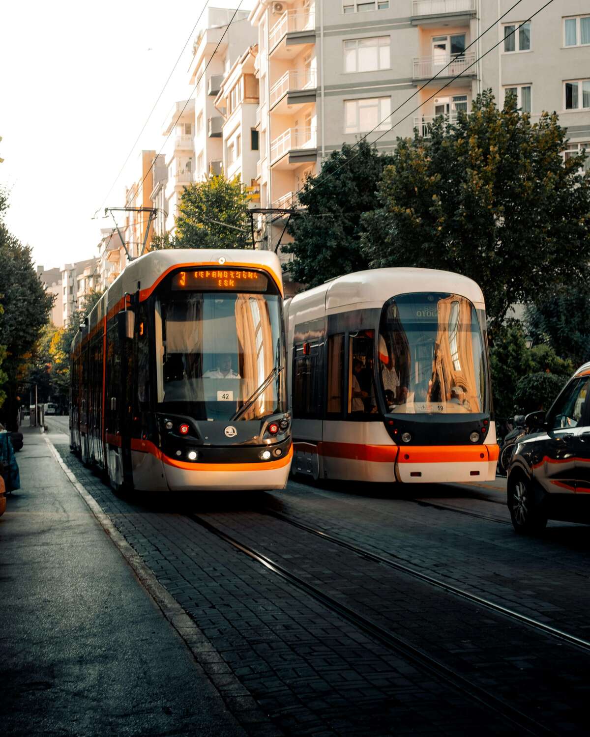 Modern tram in European city street, showcasing public transport options for getting around Europe  