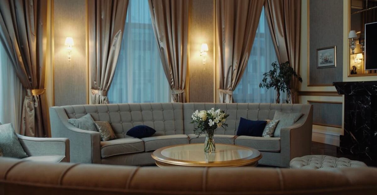 Elegant hotel living room with sofa and soft lighting, representing comfortable accommodation in Europe 