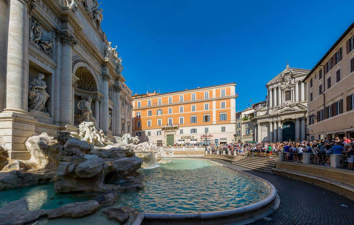 10-Day Italy itinerary famous Trevi Fountain in Rome, Italy on a bright summer day.